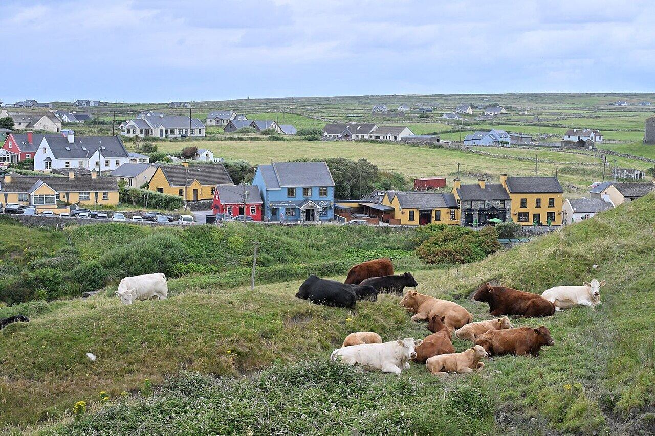 Fisher Street in Doolin with pubs and parked cars