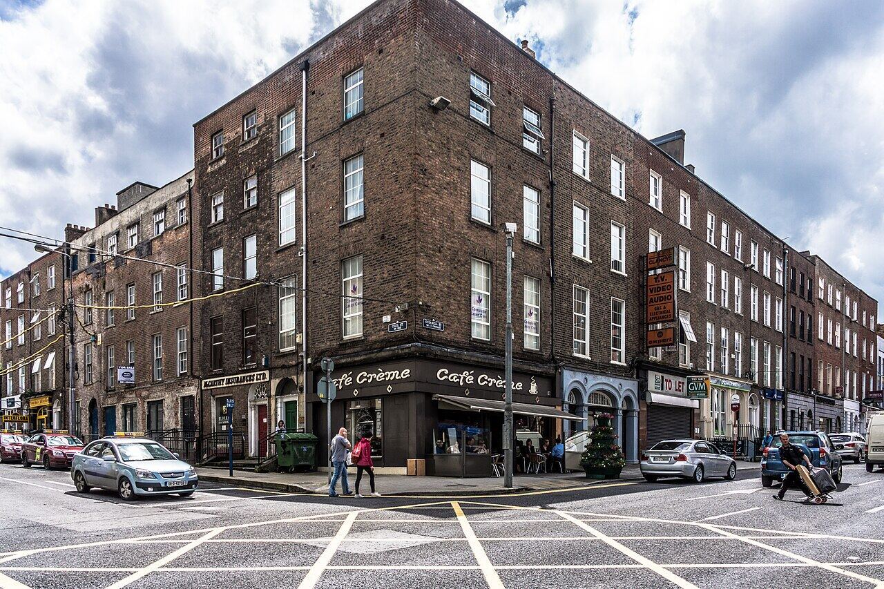 A red-brick corner building with a café in Limerick city centre