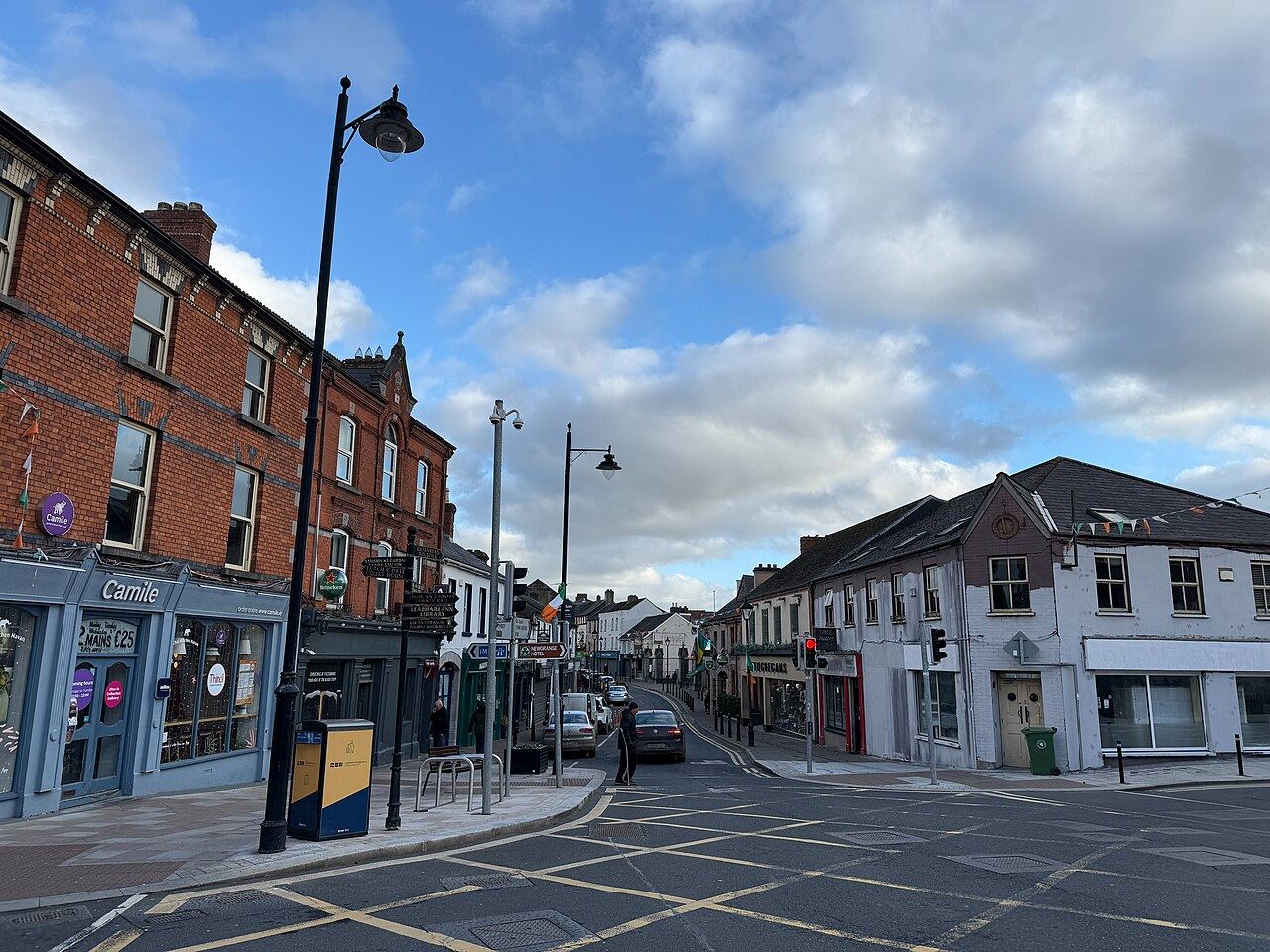 Trimgate Street in Navan town centre, brick shopfronts and street lamps at a junction