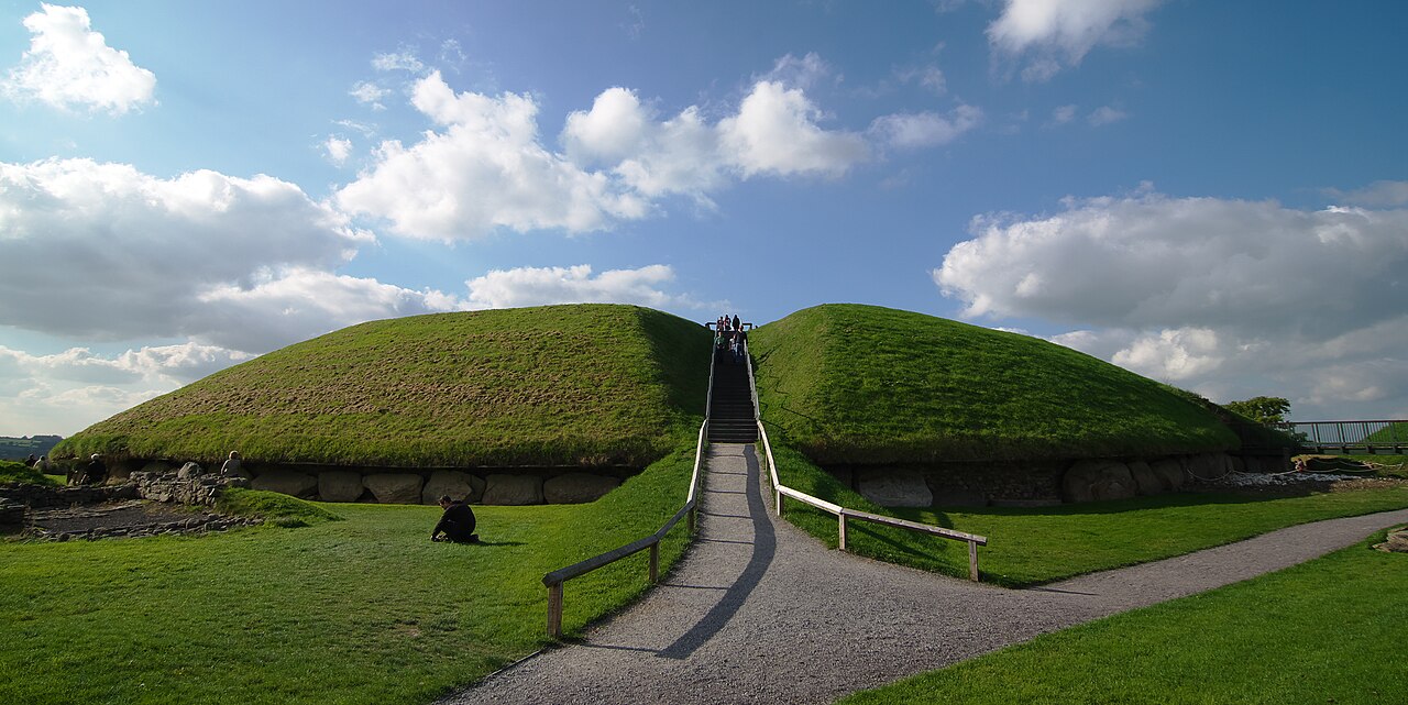 The grassy passage tomb mound at Knowth with a path and steps leading up it
