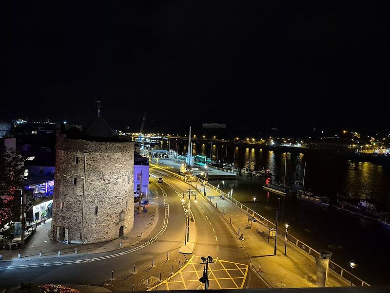 Reginald's Tower and the quay road lit up at night