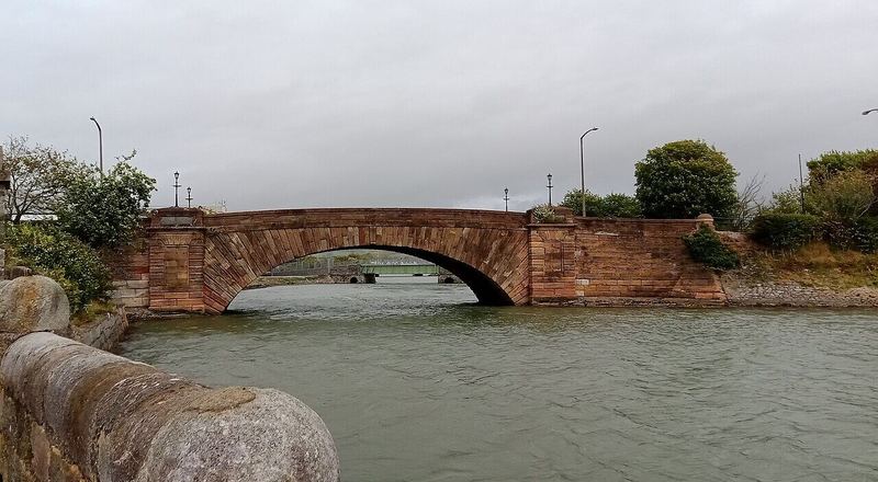 The stone Causeway Bridge in Dungarvan at high tide
